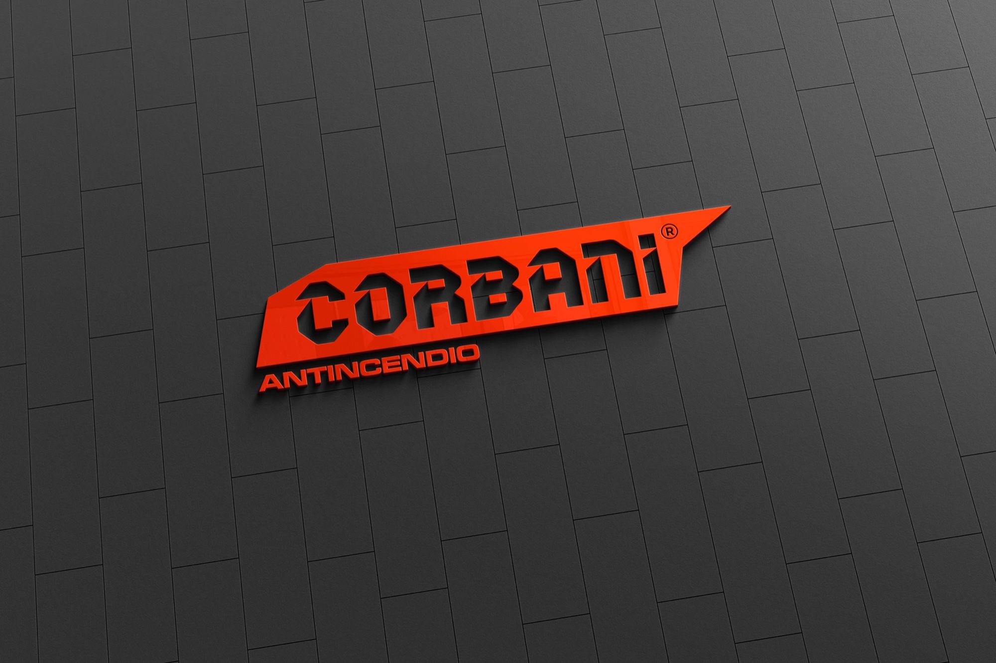 Logo Corbani Antincendio in rilievo su una parete scura